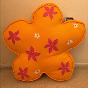 Orange flower accent pillow